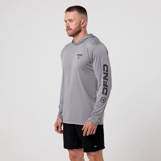 A man wearing the DFND Speed Tech Hoodie and Aero Short Outdoor Kit stands against a plain white background.
