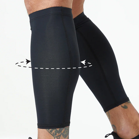 Two legs wear DFND Bundle test product black compression calf sleeves, shown with a dashed arrow circling one calf to highlight focused compression and support like an arm or knee sleeve.