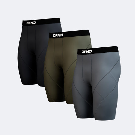 The DFND Compression Short 3-Pack includes black, olive green, and gray pairs with black "DFND"-branded waistbands, providing targeted compression for performance support. All three are shown side by side.